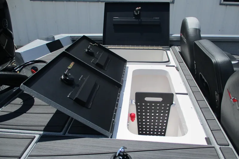 Slide: The Image of 2026 Vexus AVX1980 boat storage compartments with open lids and seating area. - 18