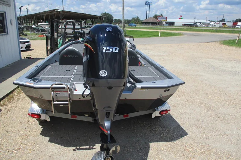 Slide: The Image of 2026 Vexus AVX1980 boat with Yamaha 150 engine, parked outdoors on a sunny day. - 3