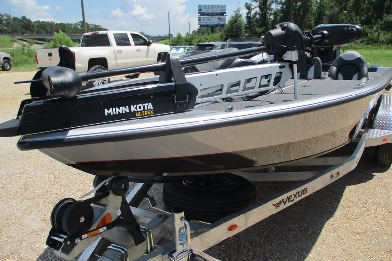 Slide: The Image of 2026 Vexus AVX1980 boat with Minn Kota Ultrex motor on trailer. - 4