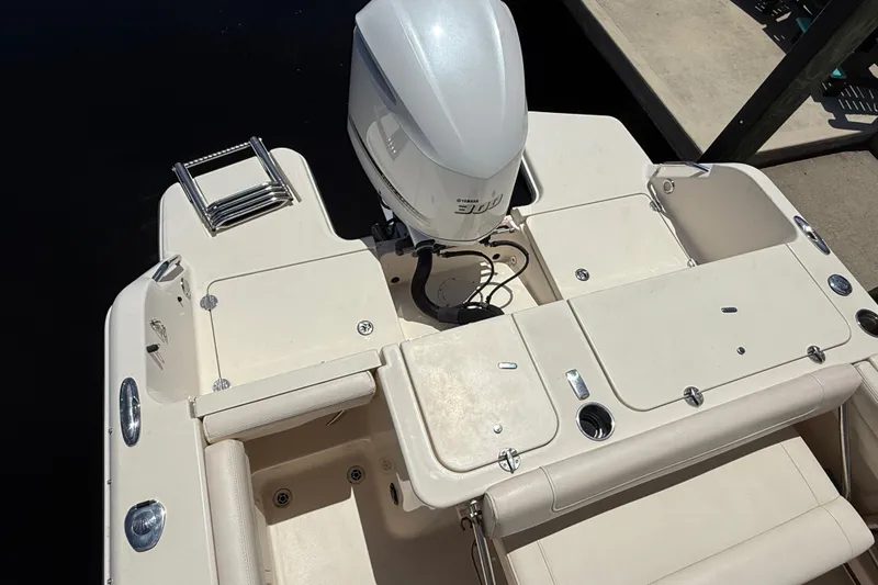 Slide: The Image of 2019 Grady-White Freedom 235 boat with Yamaha engine, featuring spacious deck and seating. - 9