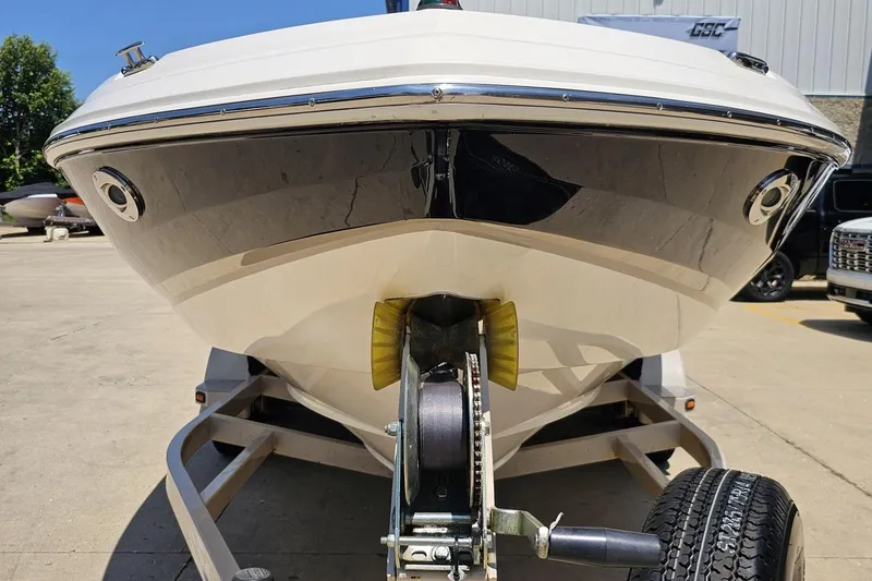 Slide: The Image of 2007 Regal 2000 Bowrider boat on trailer, front view, outdoors. - 10