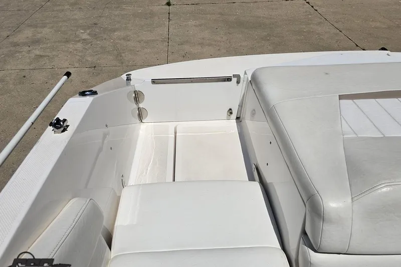 Slide: The Image of 2007 Regal 2000 Bowrider interior with white seating and clean deck. - 103