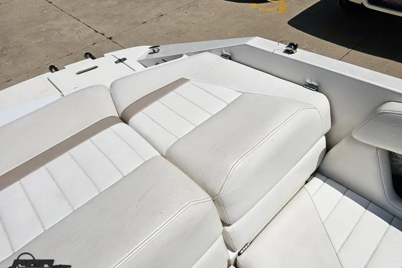 Slide: The Image of 2007 Regal 2000 Bowrider boat interior with white cushioned seating. - 106
