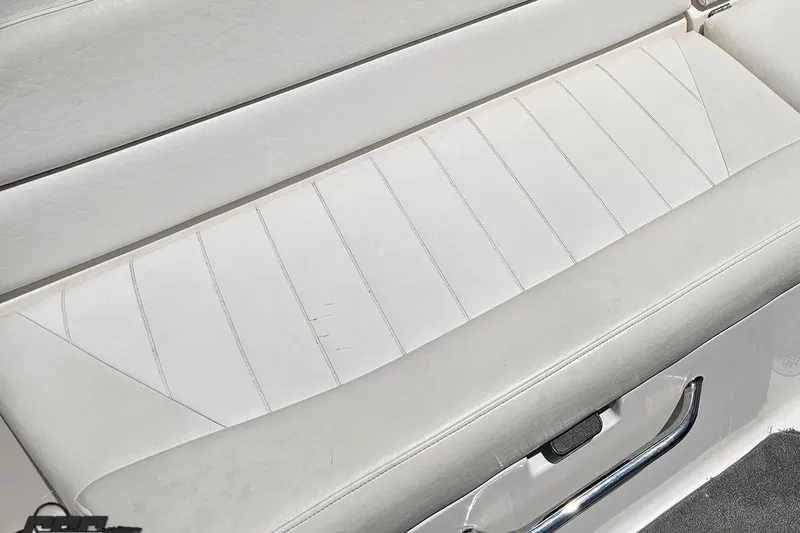 Slide: The Image of White leather seat on 2007 Regal 2000 Bowrider boat, featuring sleek design and stitching. - 108