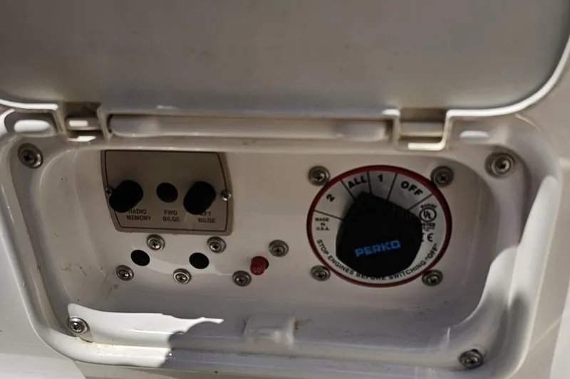 Slide: The Image of Control panel of a 2007 Regal 2000 Bowrider boat with switches and dial. - 111