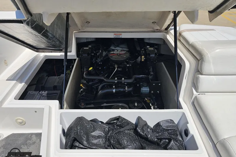 Slide: The Image of 2007 Regal 2000 Bowrider engine compartment with open hatch, showcasing the motor. - 112