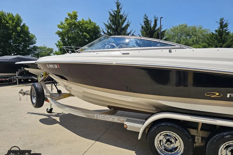 Slide: The Image of 2007 Regal 2000 Bowrider boat on trailer, parked outdoors. - 22