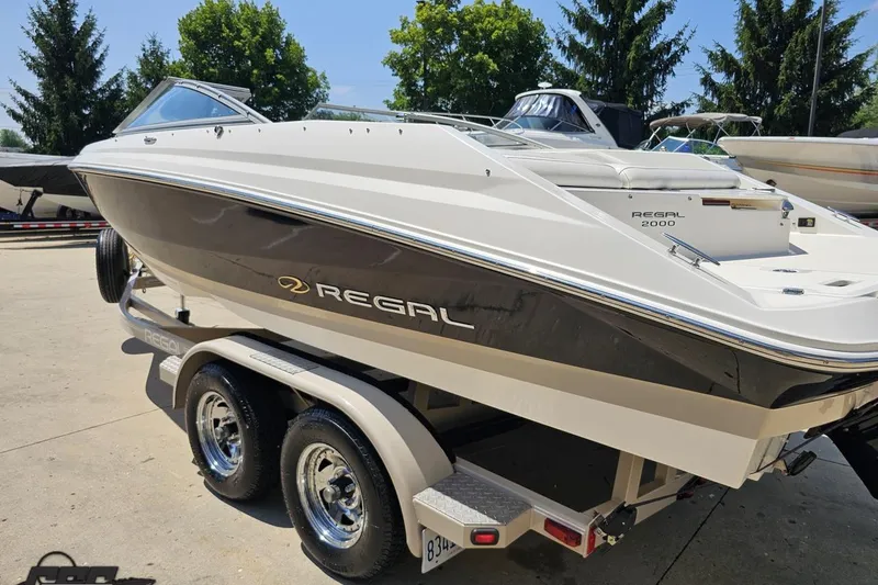 Slide: The Image of 2007 Regal 2000 Bowrider boat on trailer, parked outdoors. - 25