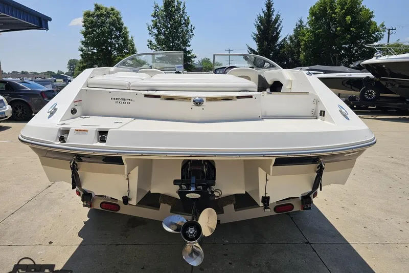 Slide: The Image of 2007 Regal 2000 Bowrider boat, rear view, parked outdoors on a sunny day. - 28