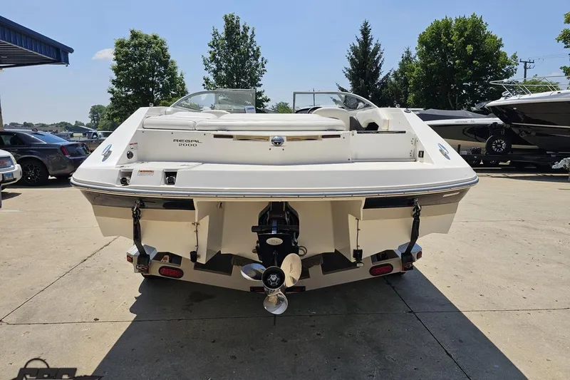 Slide: The Image of 2007 Regal 2000 Bowrider boat, rear view, parked outdoors on a sunny day. - 29
