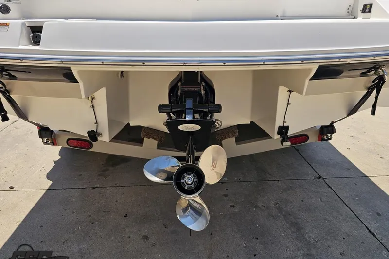 Slide: The Image of Rear view of 2007 Regal 2000 Bowrider boat with propeller and outboard motor. - 30