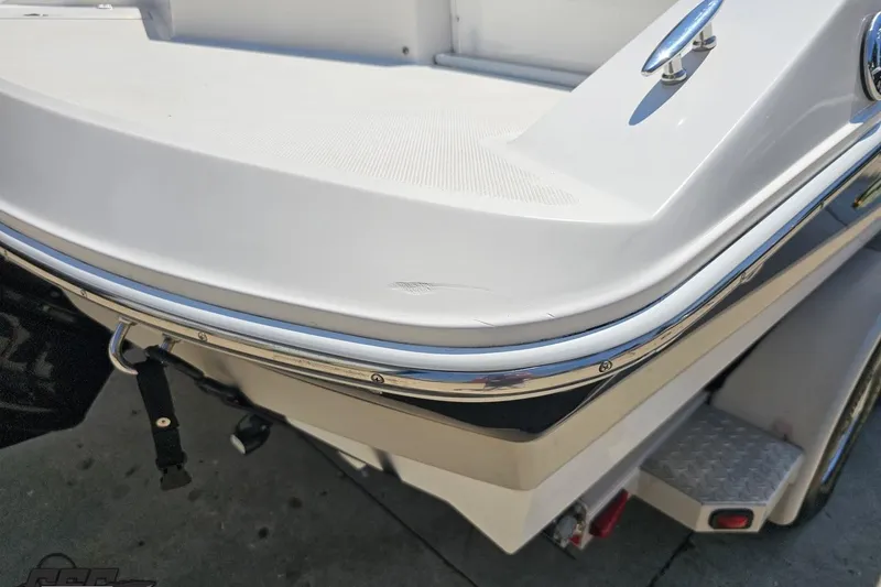Slide: The Image of 2007 Regal 2000 Bowrider boat rear view with chrome trim and trailer. - 31