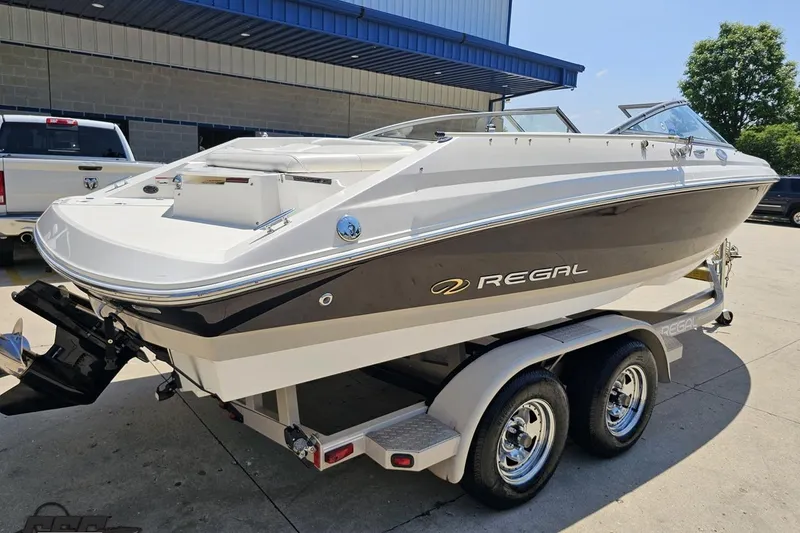 Slide: The Image of 2007 Regal 2000 Bowrider boat on trailer, parked outdoors. - 32