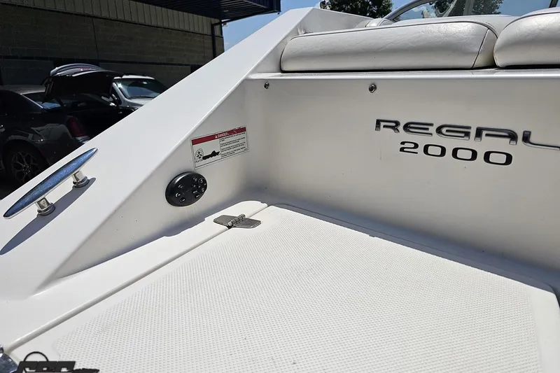 Slide: The Image of 2007 Regal 2000 Bowrider boat interior with logo and seating area. - 35