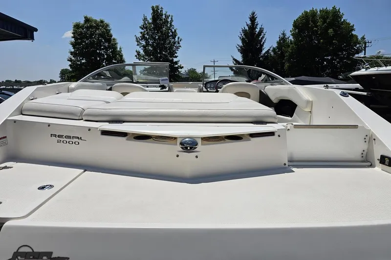 Slide: The Image of 2007 Regal 2000 Bowrider boat with white seating and sleek design. - 36