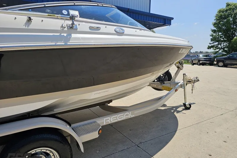 Slide: The Image of 2007 Regal 2000 Bowrider boat on trailer, parked outdoors. - 4