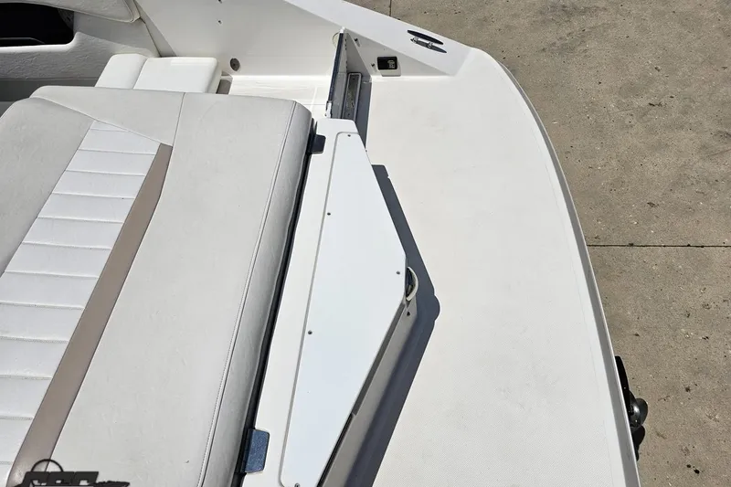 Slide: The Image of 2007 Regal 2000 Bowrider boat interior with white seating and deck. - 41