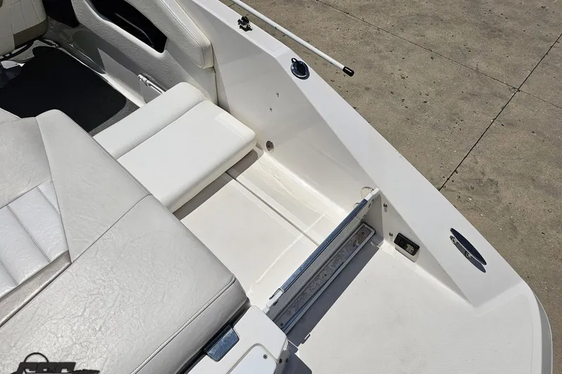 Slide: The Image of 2007 Regal 2000 Bowrider interior with white seating and deck details. - 43