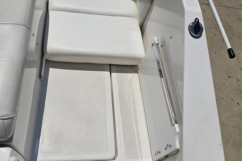 Slide: The Image of 2007 Regal 2000 Bowrider interior with white seating and deck details. - 44