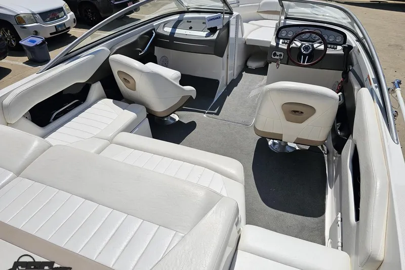 Slide: The Image of 2007 Regal 2000 Bowrider interior with white seating and modern dashboard. - 45
