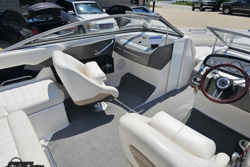 Slide: The Image of 2007 Regal 2000 Bowrider interior with white seating and modern dashboard. - 46