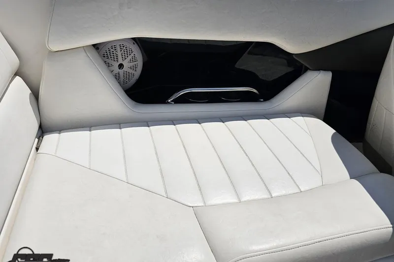 Slide: The Image of White leather seating in a 2007 Regal 2000 Bowrider boat interior. - 48