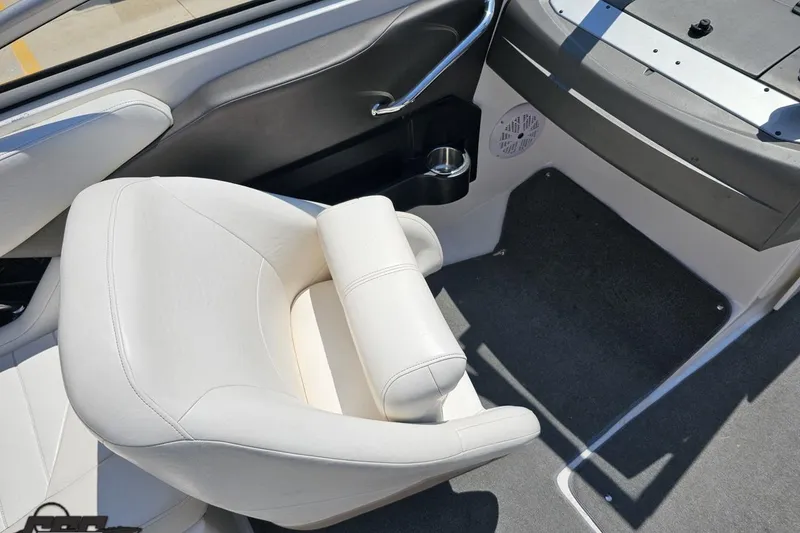 Slide: The Image of 2007 Regal 2000 Bowrider interior with white seating and cup holder. - 55