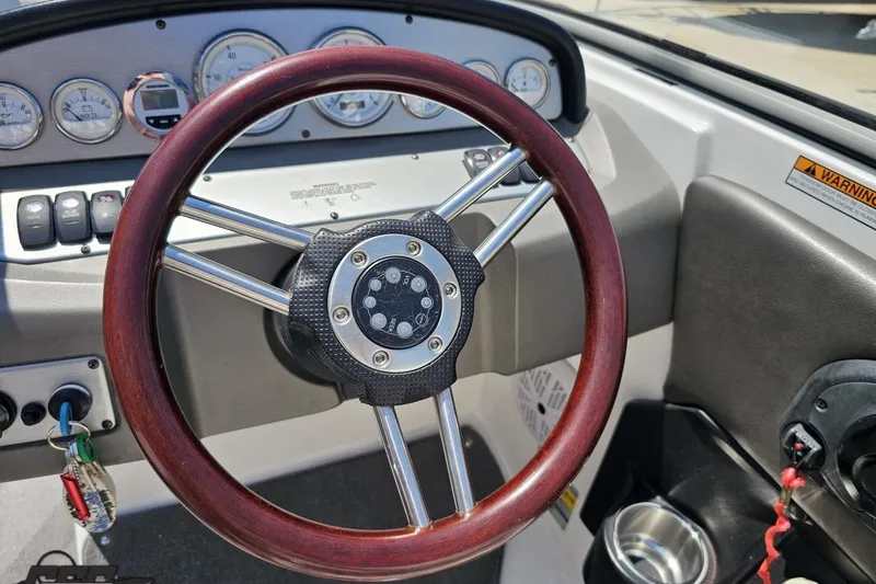Slide: The Image of Steering wheel and dashboard of 2007 Regal 2000 Bowrider boat. - 66