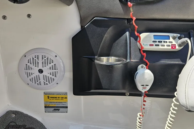 Slide: The Image of 2007 Regal 2000 Bowrider interior with radio, speaker, and capacity label. - 68