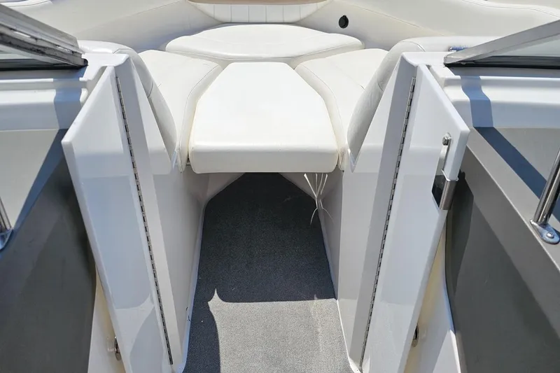 Slide: The Image of 2007 Regal 2000 Bowrider interior with white seating and carpeted floor. - 70