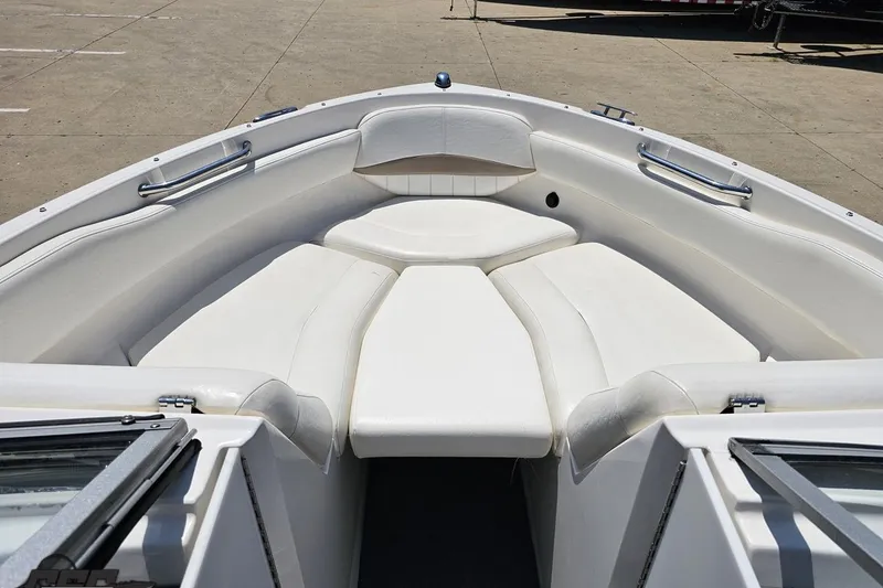 Slide: The Image of 2007 Regal 2000 Bowrider boat with white cushioned seating in the bow area. - 71