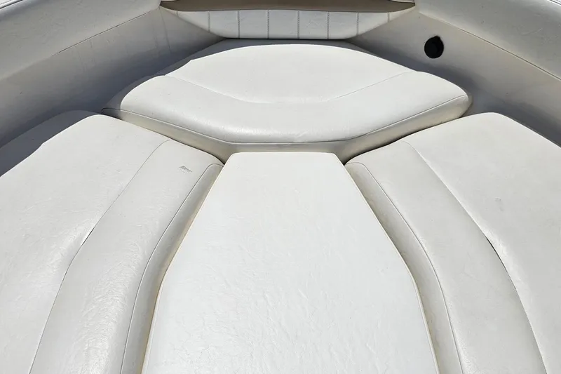 Slide: The Image of 2007 Regal 2000 Bowrider boat interior with white cushioned seating. - 73
