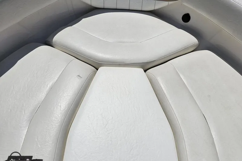 Slide: The Image of 2007 Regal 2000 Bowrider boat interior with white cushioned seating. - 74