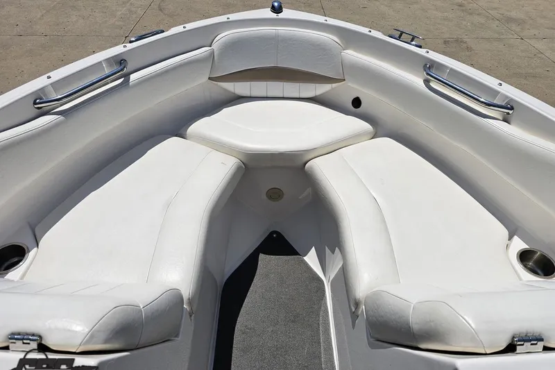 Slide: The Image of 2007 Regal 2000 Bowrider boat interior with white seating and stainless steel handles. - 75