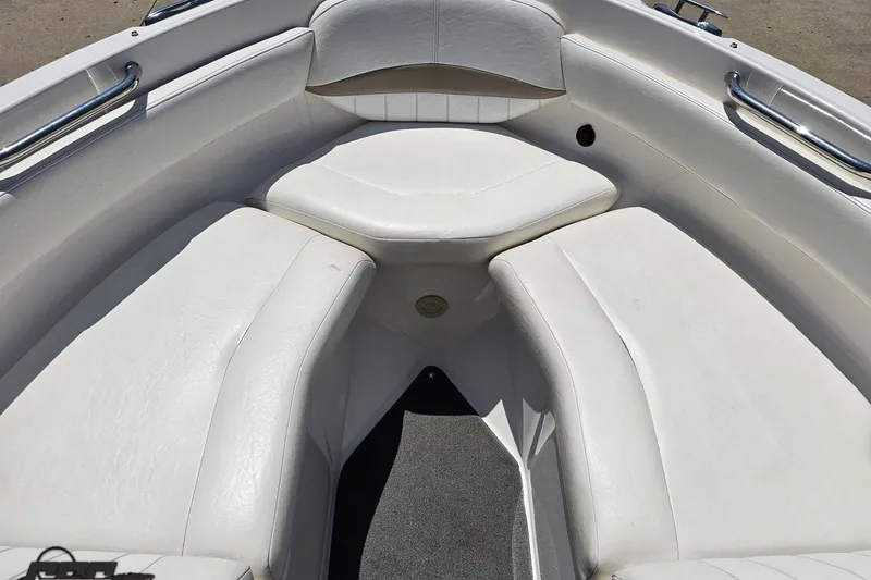 Slide: The Image of 2007 Regal 2000 Bowrider boat interior with white cushioned seating. - 76
