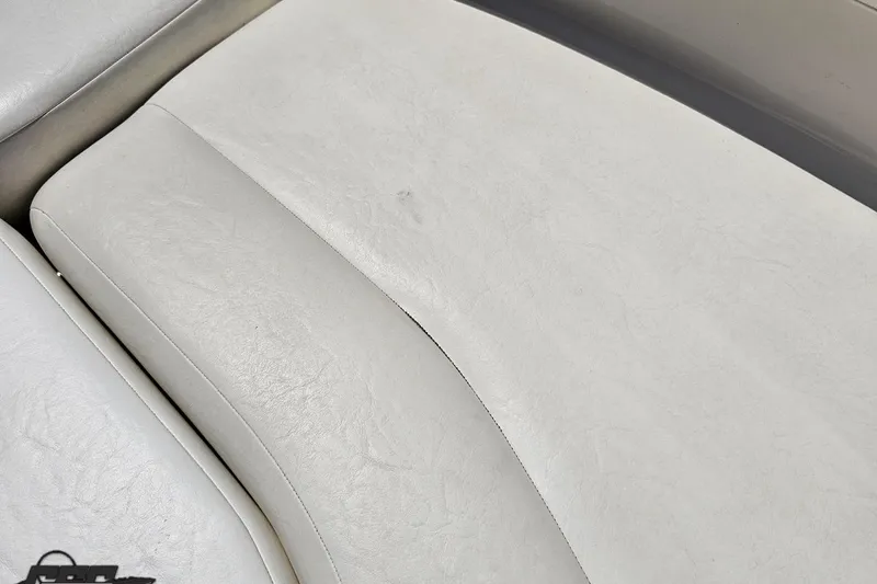 Slide: The Image of Close-up of white leather seating on a 2007 Regal 2000 Bowrider boat. - 78