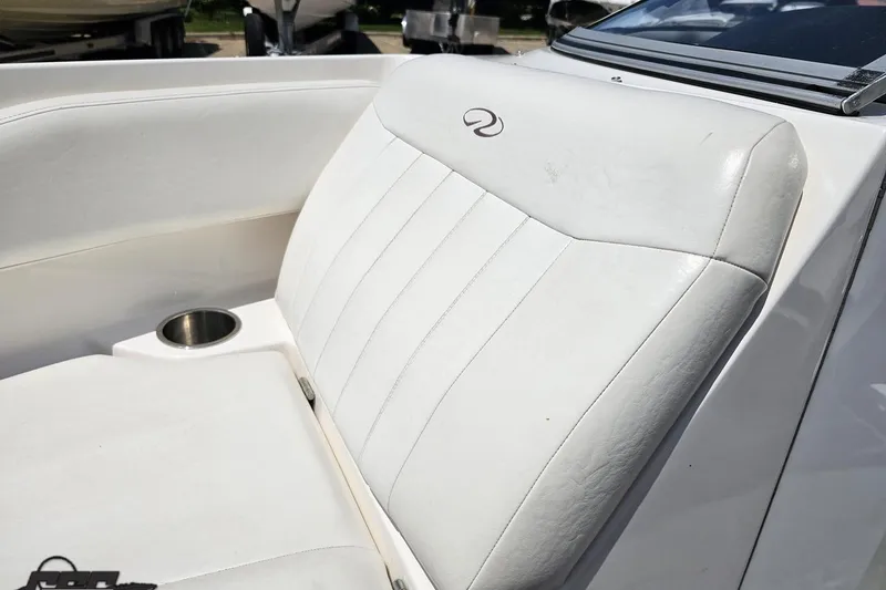 Slide: The Image of White leather seating on a 2007 Regal 2000 Bowrider boat with cup holder. - 79