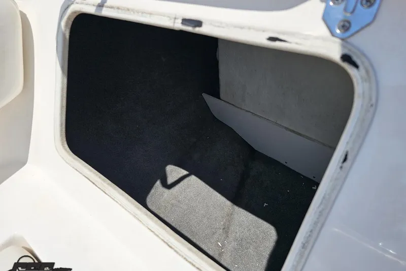 Slide: The Image of Storage compartment of a 2007 Regal 2000 Bowrider boat, showing interior space. - 80