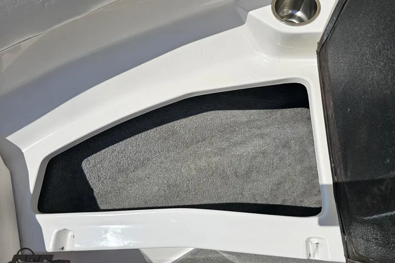 Slide: The Image of 2007 Regal 2000 Bowrider interior detail with cup holder and storage area. - 81