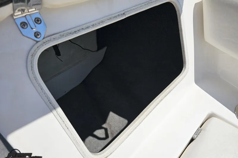 Slide: The Image of Open storage compartment in 2007 Regal 2000 Bowrider boat. - 84