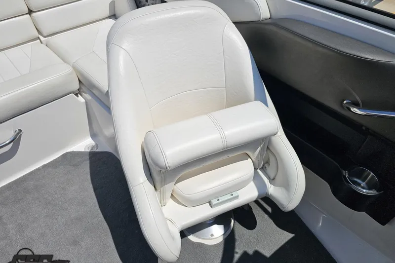 Slide: The Image of White leather seat in a 2007 Regal 2000 Bowrider boat interior. - 91