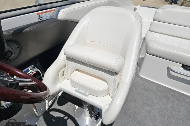 Slide: The Image of 2007 Regal 2000 Bowrider interior with white leather seating and steering wheel. - 93