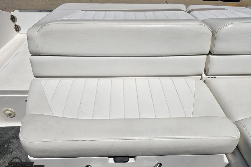 Slide: The Image of White leather seating on a 2007 Regal 2000 Bowrider boat. - 96