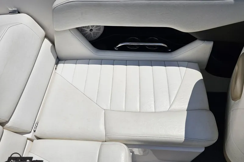 Slide: The Image of White leather seating in a 2007 Regal 2000 Bowrider boat interior. - 98