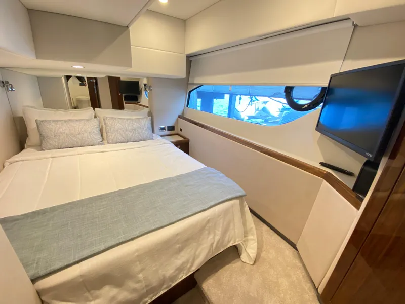 Slide: The Image of Luxurious bedroom interior of 2025 Riviera 465 SUV yacht with modern amenities. - 20