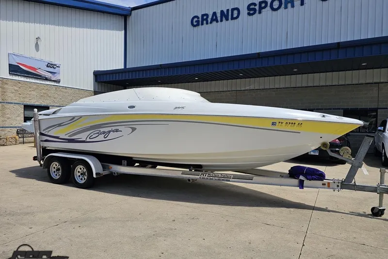 Slide: The Image of 2005 Baja 245 boat on trailer outside Grand Sport Center. - 11