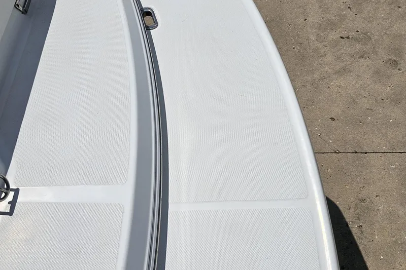 Slide: The Image of Close-up of a 2005 Baja 245 boat deck with textured surface. - 33
