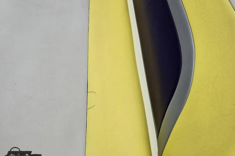 Slide: The Image of Close-up of 2005 Baja 245 boat upholstery with yellow, gray, and black patterns. - 44