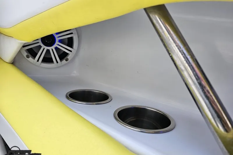 Slide: The Image of Interior of 2005 Baja 245 boat with speaker and cup holders. - 47