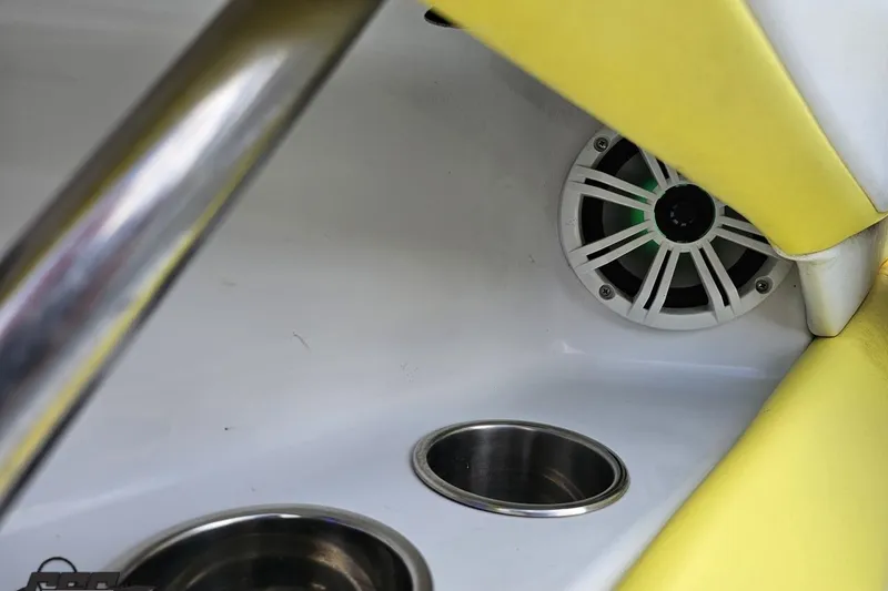 Slide: The Image of Interior of 2005 Baja 245 boat with speaker and cup holders. - 54